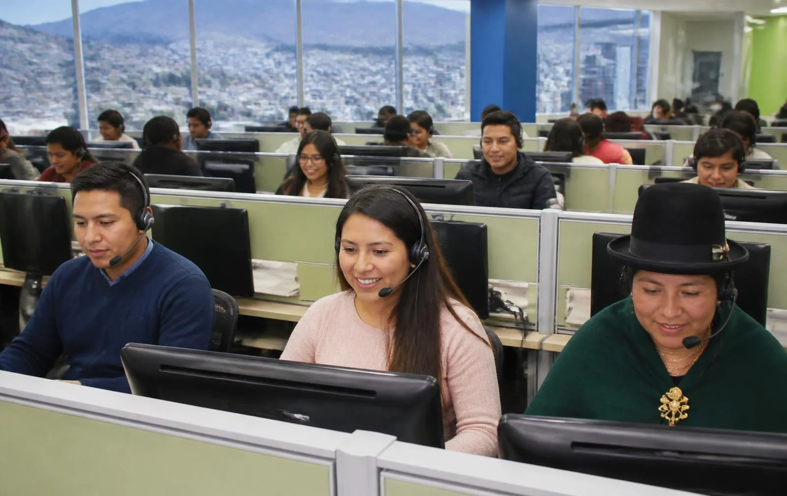 Call center agents from Ecuador working with headsets on a modern operations floor